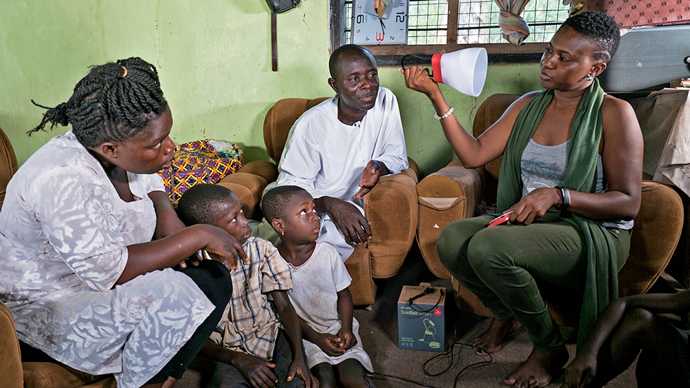 Bright Products representative presenting the SunBell in rural Ghana